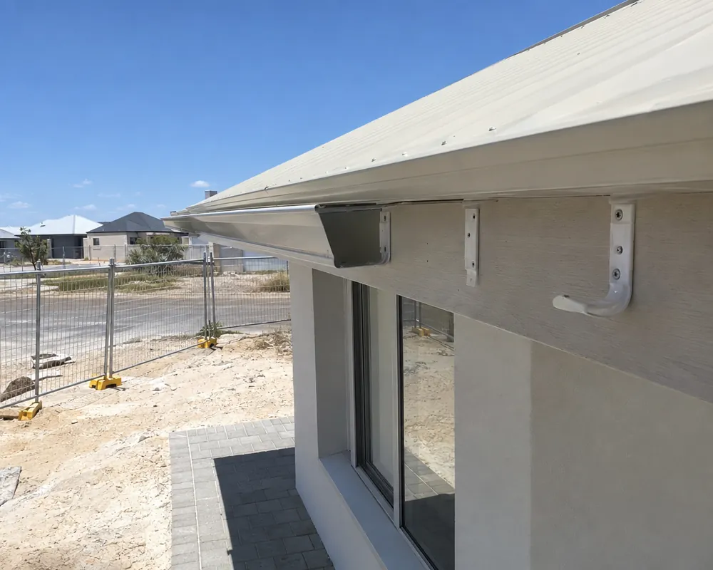 Gutter installation Perth: new gutter being fitted to a new-build home with brackets on the fascia in a Perth estate